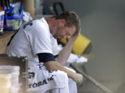 Seattle Mariners starting pitcher Wade LeBlanc sits in the dugout after being relieved in the fifth inning of a baseball game against the Houston Astros, Wednesday, Aug. 1, 2018, in Seattle.