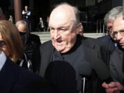 Former Adelaide Archbishop Philip Wilson leaves Newcastle Local Court on Tuesday in Newcastle, Australia, after a post-sentencing decision allowing him to to serve his 1-year sentence in home detention.