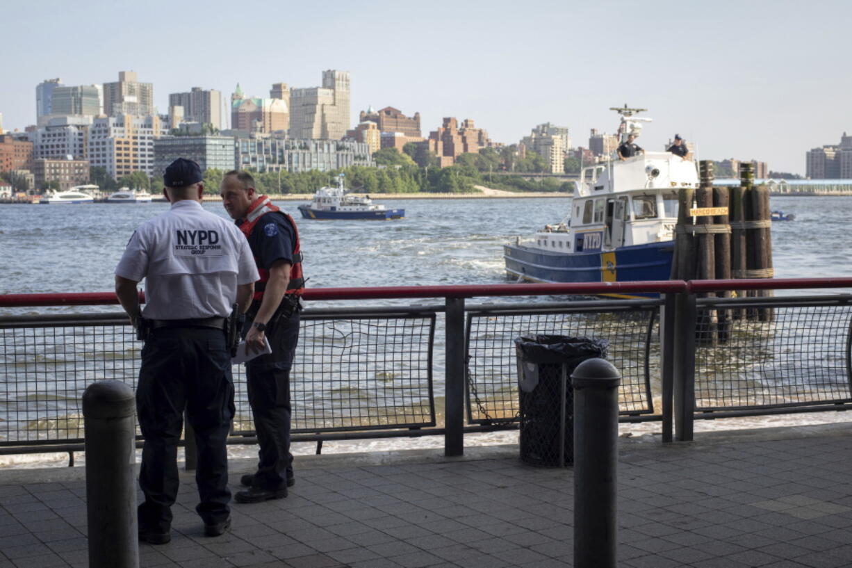 Authorities investigate the death of a baby boy who was found floating in the water near the Brooklyn Bridge in Manhattan, on Sunday in New York. No parent or guardian was present at the scene and the child showed no signs of trauma, police said. The medical examiner will determine the exact cause of death.