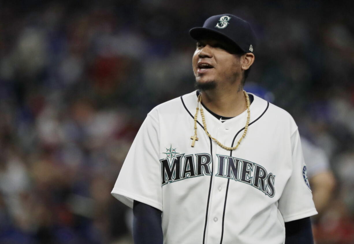 Seattle Mariners starting pitcher Felix Hernandez smiles as he walks off the field following the top of the fifth inning of the team’s baseball game against the Toronto Blue Jays, Thursday, Aug. 2, 2018, in Seattle. Hernandez was relieved by Adam Warren in the sixth inning. (AP Photo/Ted S.