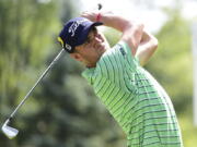 Justin Thomas watches his tee shot on the seventh hole during the final round of the Bridgestone Invitational golf tournament at Firestone Country Club, Sunday, Aug. 5, 2018, in Akron, Ohio.