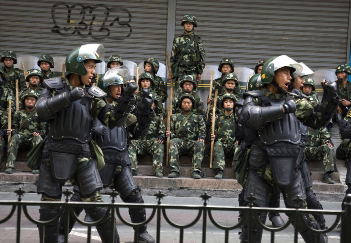 Chinese paramilitary police practice during a break from patrol in Urumqi, western China’s Xinjiang province. A group of U.S. lawmakers has urged the Trump administration to impose sanctions including asset freezes and visa bans on Chinese officials and companies allegedly tied to a stifling security crackdown and the mass internment of ethnic minority Muslims in camps in a far western region. The lawmakers sent a letter to Secretary of State Mike Pompeo and Treasury Secretary Steve Mnuchin urging the government to apply sanctions to address the “ongoing human rights crisis” in the region of Xinjiang, in the latest sign that the detentions are raising concerns among Western leaders and governments.