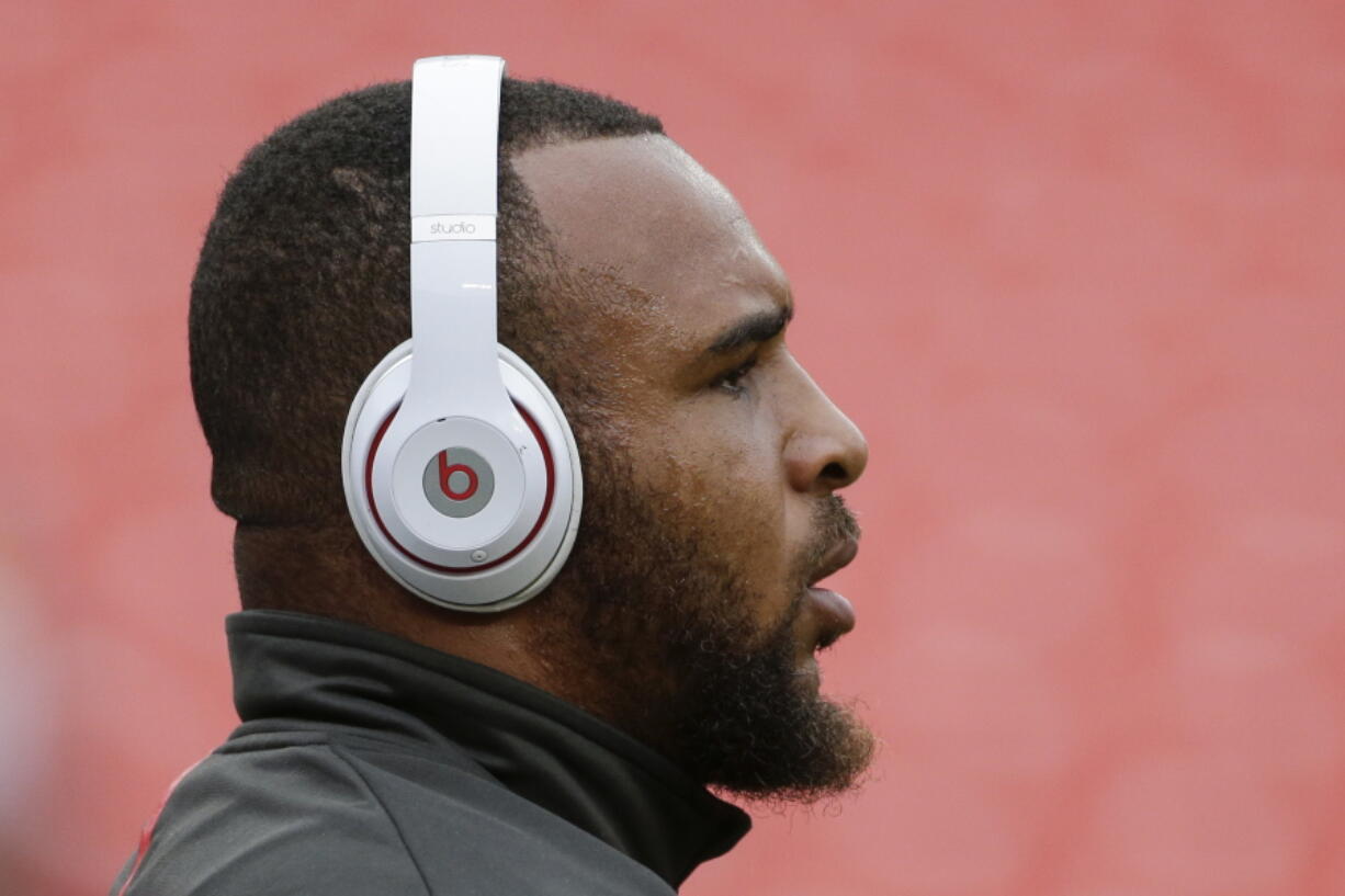 Tampa Bay Buccaneers fullback Jorvorskie Lane wears Beats headphones before an NFL football game against the Washington Redskins in Landover, Md. The Trump administration’s hit list of Chinese products facing import taxes includes key components used in gadgets that can be wirelessly operated through a smartphone or another device. The tariffs also will nail networking equipment that makes the internet work.