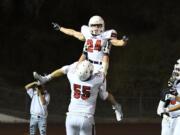 Randy Yaacoub (24) celebrates a touchdown with  TD Tristan Souza (Kris Cavin for The Columbian)