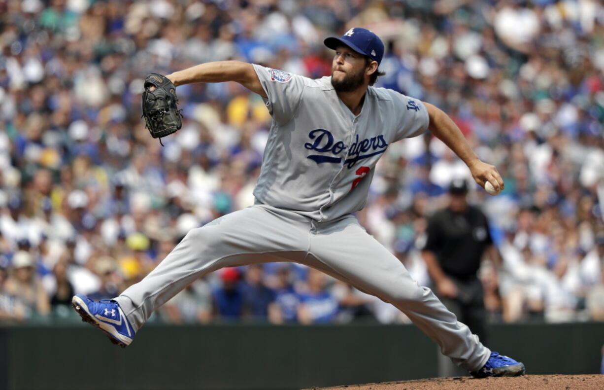 Los Angeles Dodgers starting pitcher Clayton Kershaw throws against the Seattle Mariners in the first inning of a baseball game Sunday, Aug. 19, 2018, in Seattle.