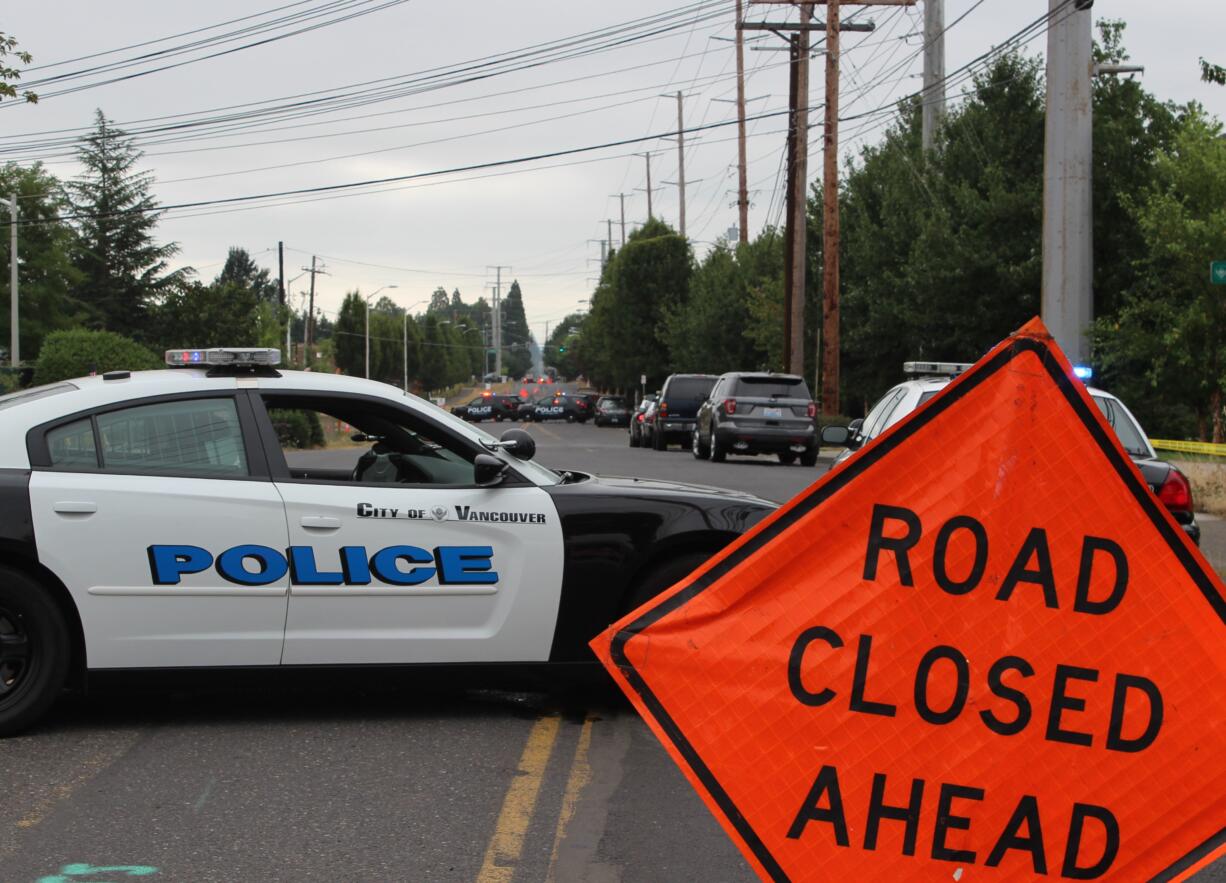 Vancouver police blocked off a section of Southeast First Street due to a man holed up in a nearby apartment the morning of Wednesday, Aug. 1, 2018. After a three-hour standoff, police arrested John C. Picano, 45.