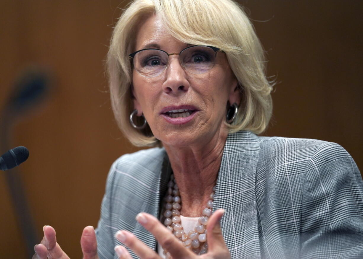 Education Secretary Betsy DeVos testifies during hearing on the FY19 budget on Capitol Hill in Washington. Support for charter schools and private school voucher programs has gone up over the past year, with Republicans accounting for much of the increase, according to a survey published Tuesday, Aug. 21.