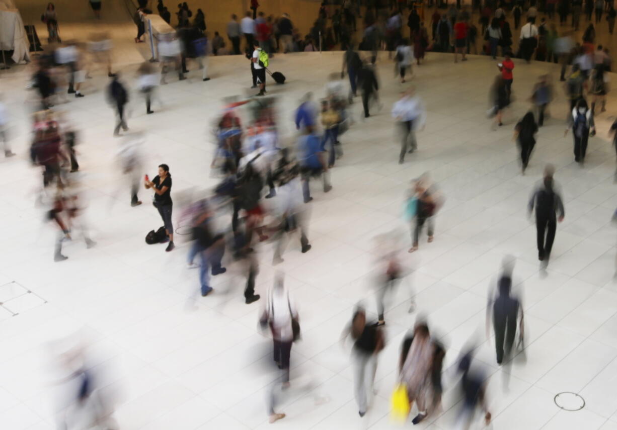 People walk inside the Oculus, the new transit station at the World Trade Center in New York. Data collection practices of tech firms are increasingly under the microscope. An Associated Press investigation shows that using Google services on Android devices and iPhones allows the search giant to record your whereabouts as you go about your day.