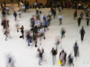 People walk inside the Oculus, the new transit station at the World Trade Center in New York. Data collection practices of tech firms are increasingly under the microscope. An Associated Press investigation shows that using Google services on Android devices and iPhones allows the search giant to record your whereabouts as you go about your day.