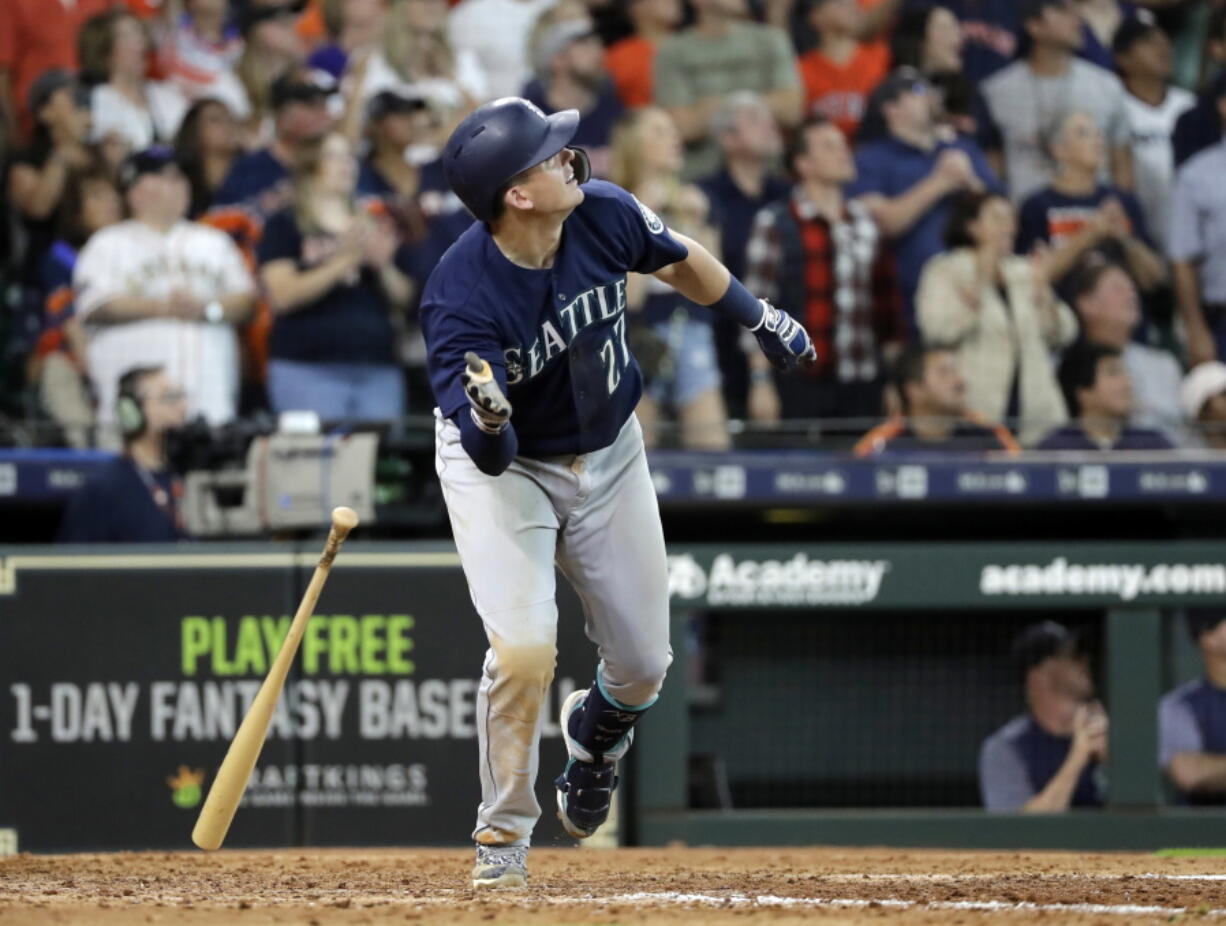 Seattle Mariners’ Ryon Healy drops his bat after hitting a home run against the Houston Astros during the ninth inning of a baseball game Sunday, Aug. 12, 2018, in Houston. (AP Photo/David J.