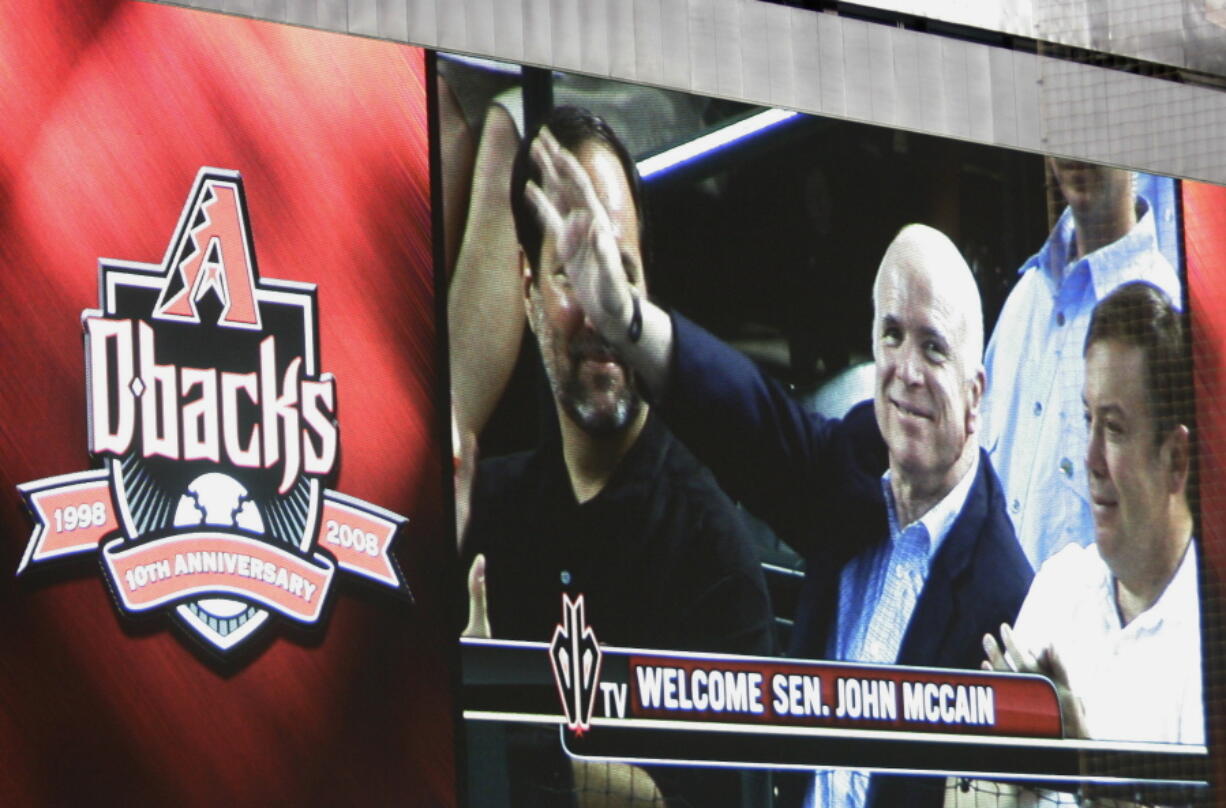 Sen. John McCain, R-Ariz., is seen on the giant replay screen during a 2008 baseball game between the Arizona Diamondbacks and Florida Marlins at Chase Field in Phoenix. The sight of McCain sitting in the stands at Chase Field became so commonplace few people seemed to even notice. The senator from Arizona would get handshakes and take pictures with fans, but he was there just to be one of them, cheering on the home team. McCain died Saturday, Aug. 25, 2018, after battling brain cancer and the Arizona sports community mourned him across the Valley of the Sun. He was 81.