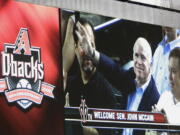 Sen. John McCain, R-Ariz., is seen on the giant replay screen during a 2008 baseball game between the Arizona Diamondbacks and Florida Marlins at Chase Field in Phoenix. The sight of McCain sitting in the stands at Chase Field became so commonplace few people seemed to even notice. The senator from Arizona would get handshakes and take pictures with fans, but he was there just to be one of them, cheering on the home team. McCain died Saturday, Aug. 25, 2018, after battling brain cancer and the Arizona sports community mourned him across the Valley of the Sun. He was 81.