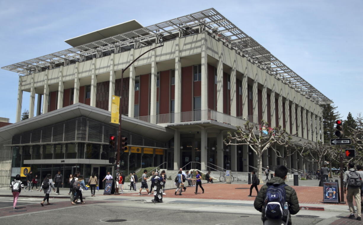 FILE- In this May 10, 2018, file photo students walk near the Martin Luther King Jr. Student Union building on the University of California at Berkeley campus in Berkeley, Calif. A 529 is a tax-advantaged investment plan that was originally designed to pay for higher education expenses. But recent changes the tax law have increased their flexibility. They now may be used to pay for private-school tuition from kindergarten through high school or transferred to accounts to pay for expenses of disabled youth.