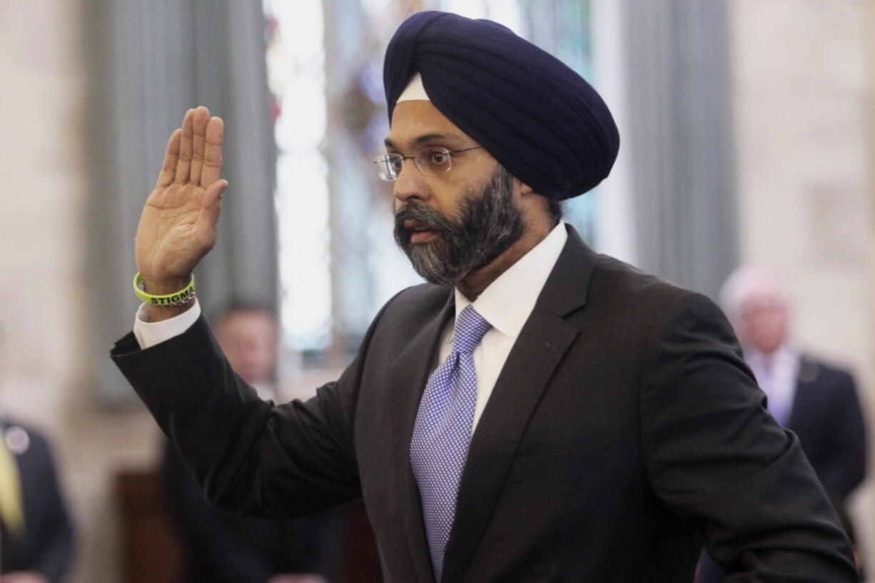 Gurbir Grewal is sworn in before testifying in front of the senate judiciary committee in Trenton, N.J. WKXW-FM hosts Dennis Malloy and Judi Franco, the hosts of a popular New Jersey radio show suspended for calling Grewal, the nation’s first Sikh attorney general “turban man,” are back on the air Monday, Aug. 6, after a 10-day suspension.