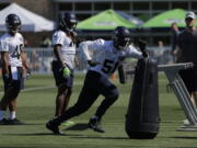 Seattle Seahawks linebacker Barkevious Mingo (51) running a drill during NFL football training camp, in Renton. (AP Photo/Ted S.