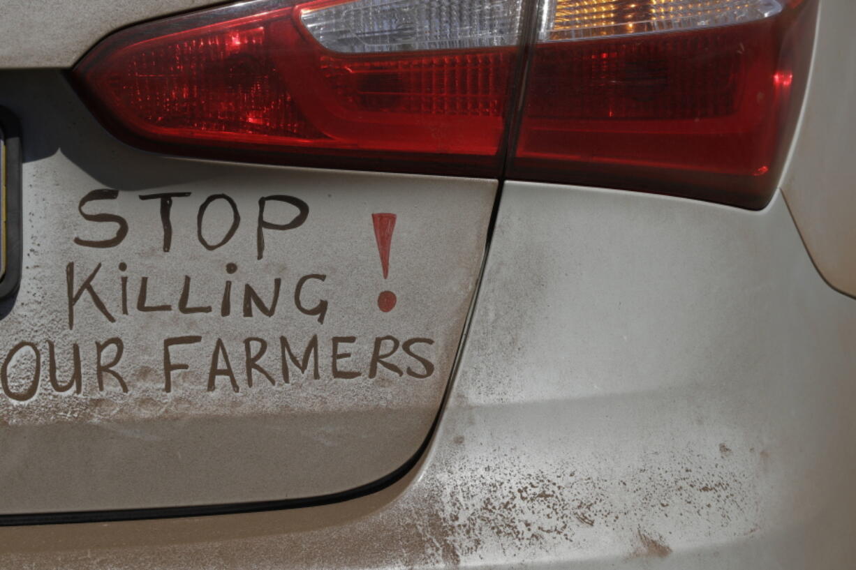 A bumper sign calls for the end of farm killings in South Africa, during a blockade of a freeway in Midvaal, South Africa. U.S. President Donald Trump has tweeted that he has asked the U.S.