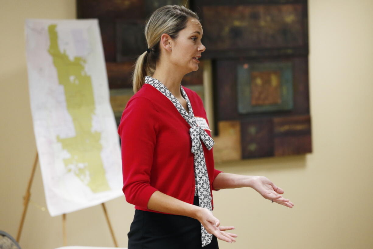 Jennifer Samuels, a teacher and a Democratic candidate for the Arizona House of Representatives in LD15, speaks to other teacher candidates and constituents at a campaign event, in Scottsdale, Ariz. Samuels was part of the Red For Ed movement by Arizona teachers successfully striking for higher pay and funding for schools. (AP Photo/Ross D.