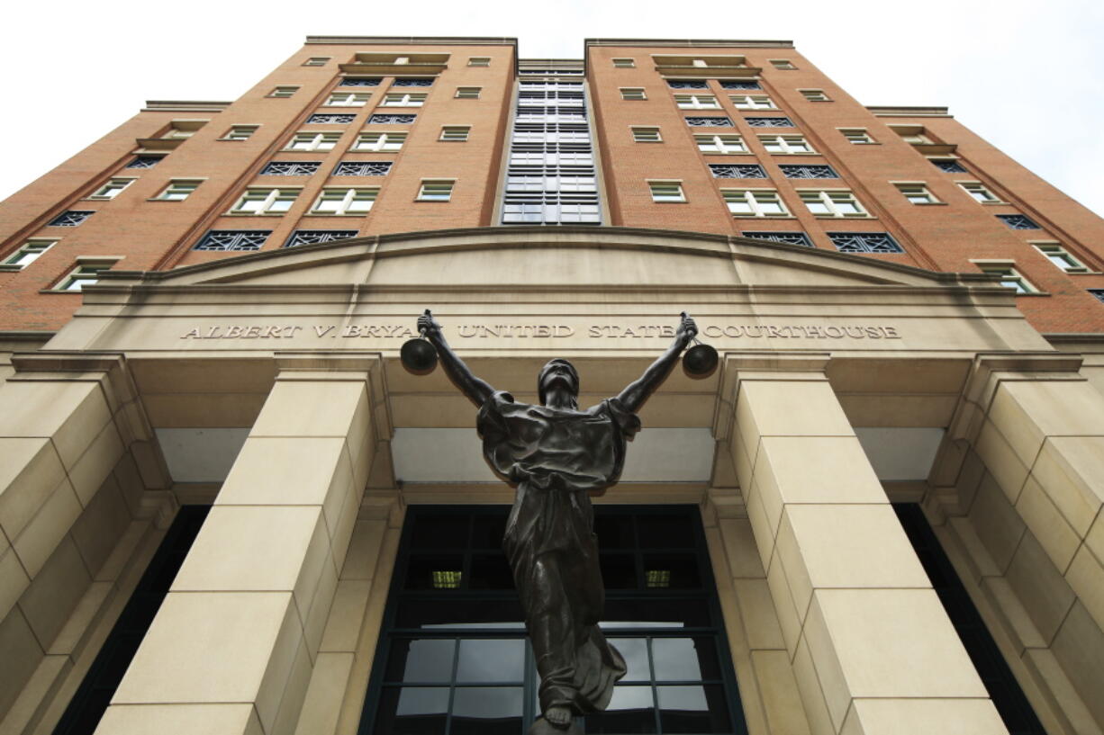 A statue adorns the front of the Albert V. Bryan United States Courthouse on Thursday in Alexandria, Va., where President Donald Trump’s former campaign chairman Paul Manafort is on trial facing federal charges of tax evasion and bank fraud.