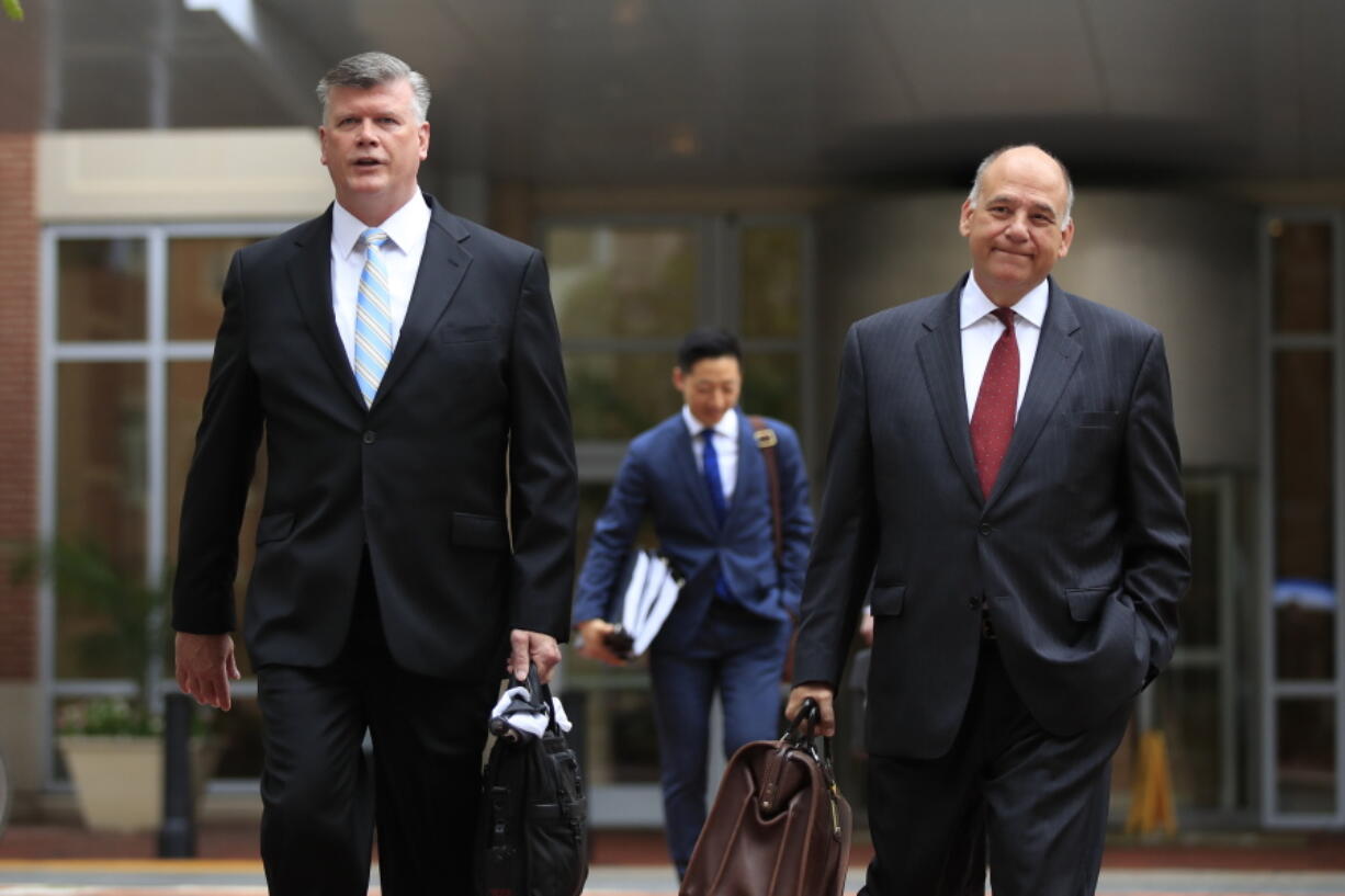 Kevin Downing, left, and Thomas Zehnle, attorneys for Paul Manafort, walk to the Alexandria Federal Courthouse in Alexandria, Va., Friday, Aug. 3, 2018, on day four of President Donald Trump’s former campaign chairman Paul Manafort’s tax evasion and bank fraud trial.