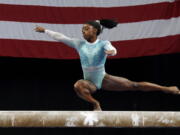 Simone Biles competes on the balance beam at the U.S. Gymnastics Championships, Sunday, Aug. 19, 2018, in Boston.