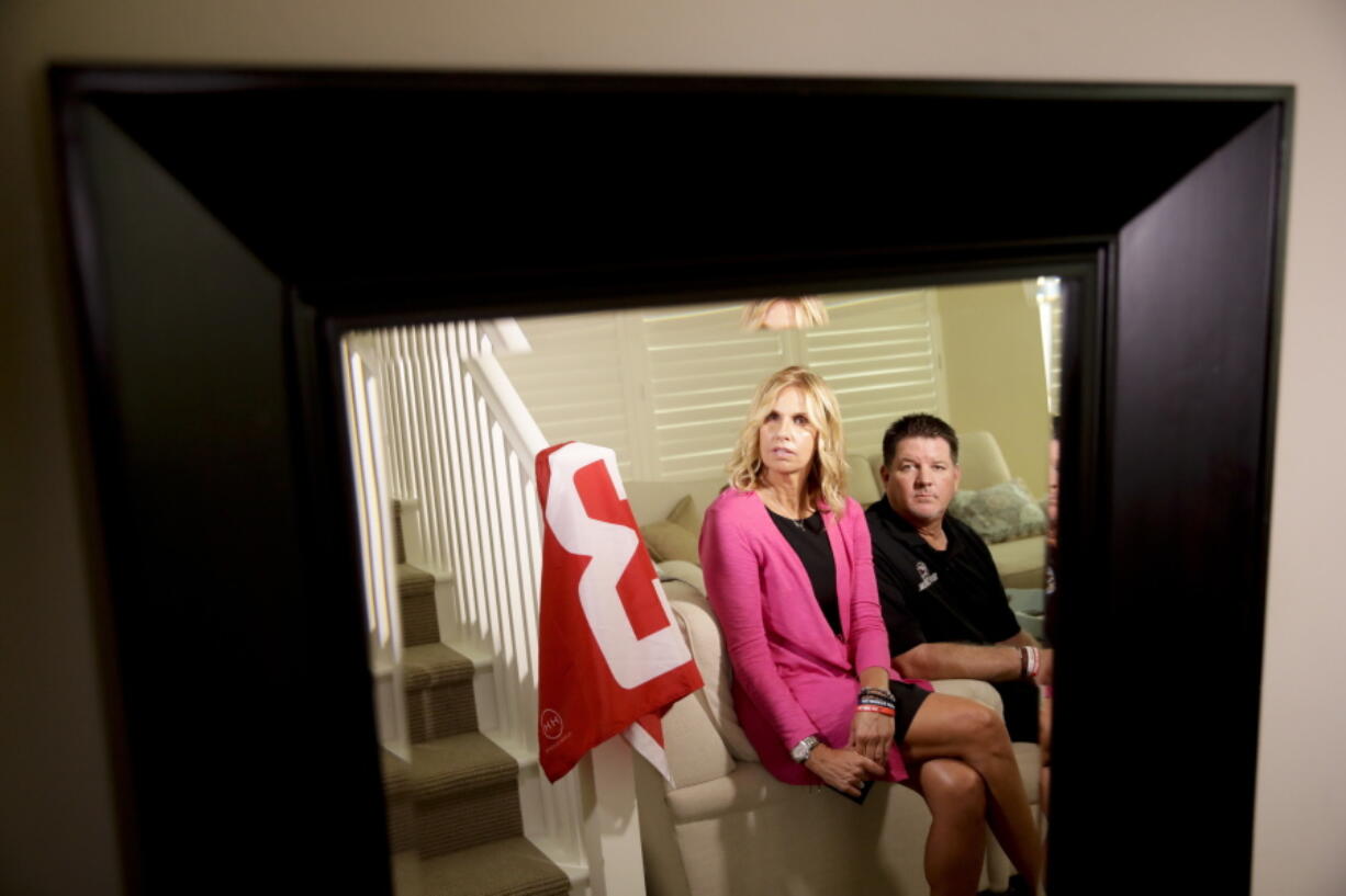 Mark and Kym Hilinski pose for a picture at their home Tuesday in Irvine, Calif. The parents of Washington State quarterback Tyler Hilinski, who killed himself in Pullman in January, have become advocates for greater awareness of mental health issues among student-athletes and are channeling their energy into Hilinski’s Hope, a foundation created to bring resources to bear on the issues.