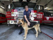 Draper firefighter Patrick Cullen with his new dog, Mendo, at Fire Station 21 on Aug. 27 in Draper, Utah. While working the Mendocino Complex Fire Cullen saw a dog come wandering over a hill. The German shepherd was taken to a veterinarian for treatment, then an animal shelter. Cullen adopted him after no one showed up to claim the dog.