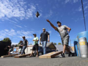 Shawn McKay, right, of Ghost Runners Brewery and Rod Edwards of Shoug Brewing compete with their fellow independent craft brewers at the Brewers Invitational Cornhole Tournament at Trap Door Brewing Sunday. The event was part of Northbank Beer Week, which runs through Saturday.