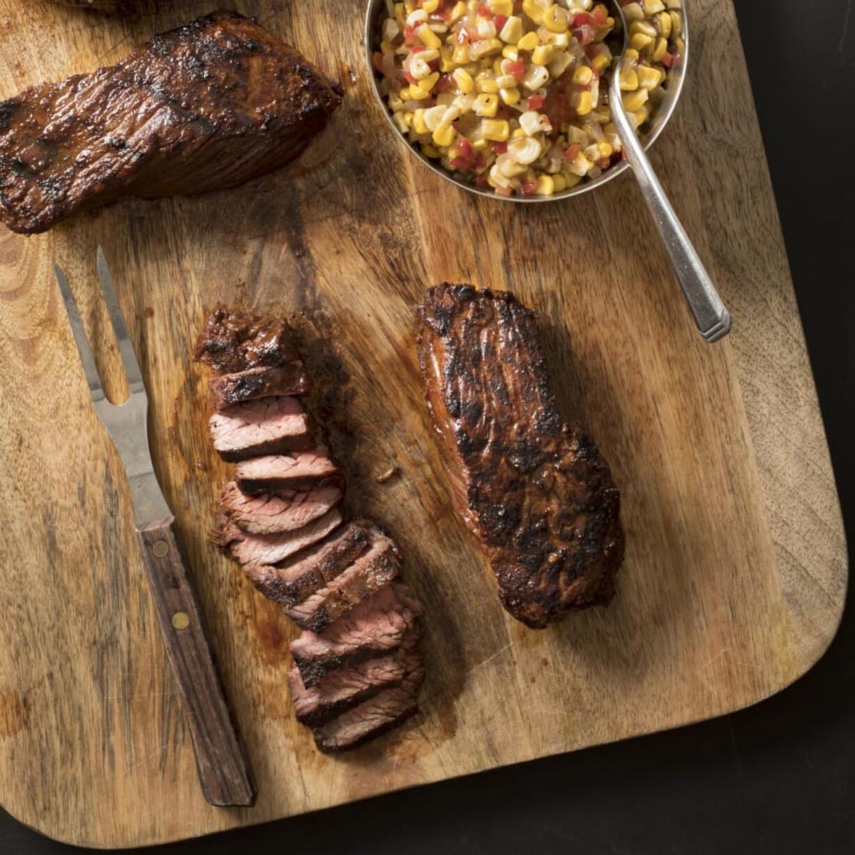 Grilled southwestern steak tips with tangy corn relish (Carl Tremblay/America’s Test Kitchen via AP)