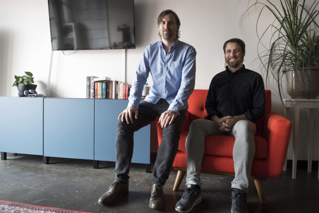 Creative Director Kyle Sullivan, left, and his brother, Design Director Derek Sullivan, pose together at Hazy Dell Press in Southeast Portland.