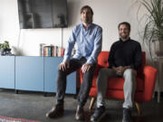 Creative Director Kyle Sullivan, left, and his brother, Design Director Derek Sullivan, pose together at Hazy Dell Press in Southeast Portland.