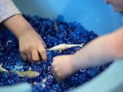 Children at the Open House Ministries day care center play with new sensory calming toys, including sensory rings. The toys were purchased through a grant, and are an innovative way to educate kids while keeping them engaged while also calming them.