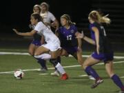 Skyview's Ava Harman (20) drives past Columbia River's Sydney Flores-Tucker (17). Skyview beat Columbia River, 1-0, in the the season opener on Tuesday, Sept. 4, 2018 at Columbia River High School in Vancouver. (Randy L.