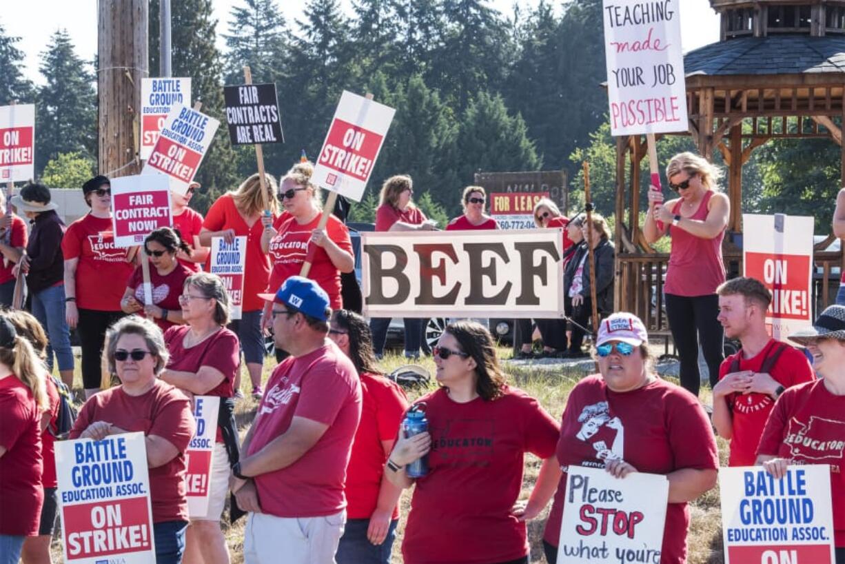 Battle Ground teachers and supporters rally at the corner of 149th Street and Highway 503 in Battle Ground on Tuesday morning during the district’s fourth day of its strike.