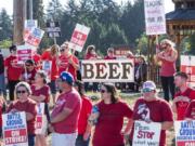 Battle Ground teachers and supporters rally at the corner of 149th Street and Highway 503 in Battle Ground on Tuesday morning during the district’s fourth day of its strike.