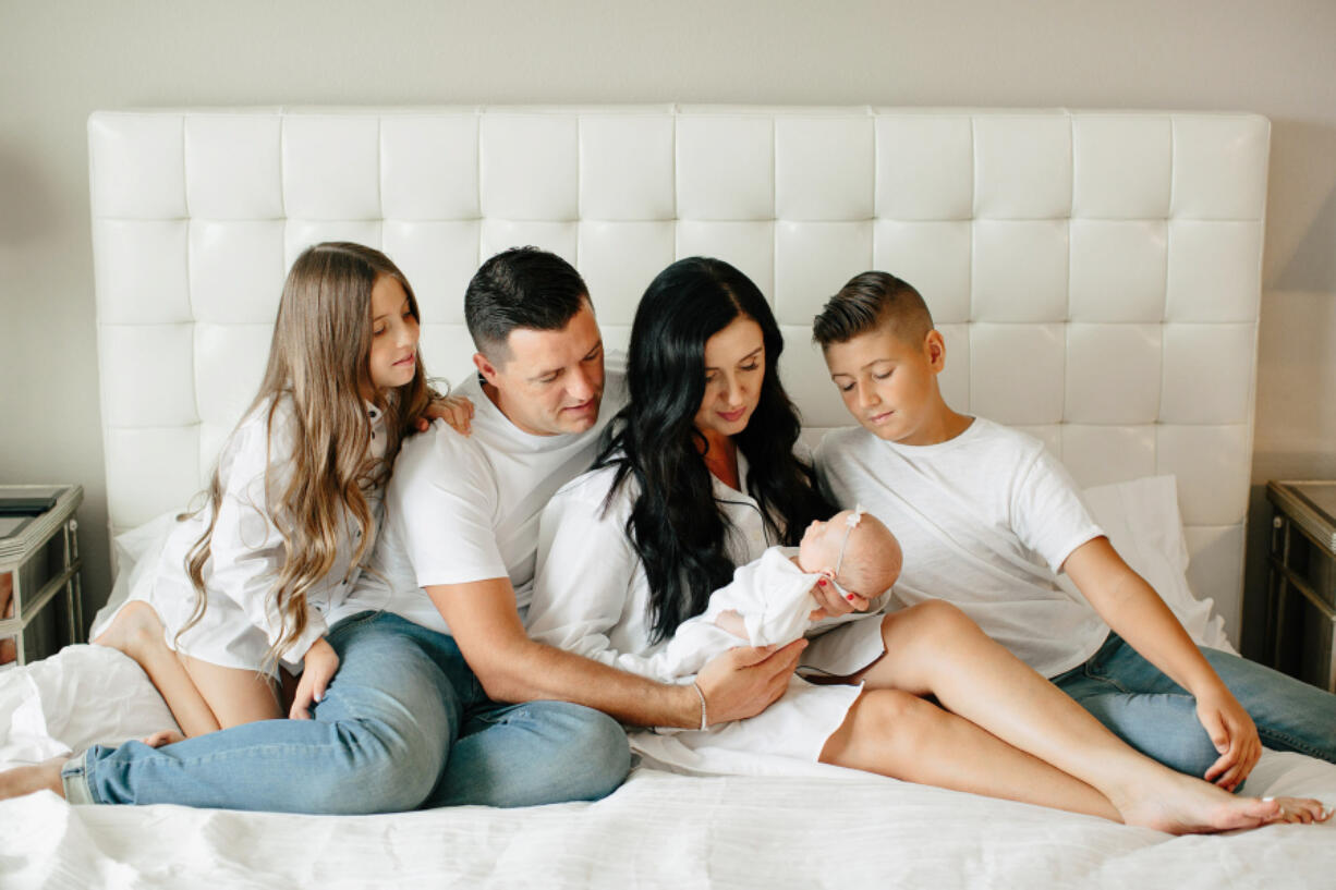 The Domanskiy family: Abigail, from left, Stan, Valenteena, Celine and Dominique. Celine Domanskiy is now 15 months old, and has taken steps and started talking. Her parents describe her as feisty.