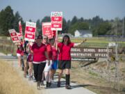 Members of the Washougal Association of Teachers join supporters in marching outside the Washougal School District Administrative Offices on Wednesday afternoon. Shortly after 6 p.m., the Washougal School District announced it had reached a tentative agreement with the teachers union to end a strike that started Aug. 28.