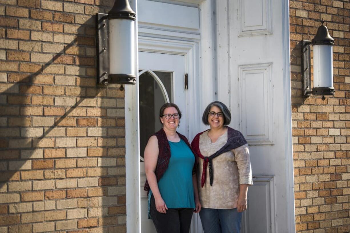 Ficstitches Yarns kit club founders Carissa Jane Reid, left, and Laurinda Reddig stand outside the Camas Public Library.