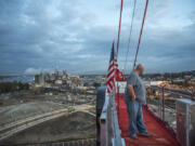 Randy Anis stands atop the tower crane he operates at The Waterfront Vancouver just after 6 a.m. Sept. 11. He has been working on the Block 8 project since October of last year. Scheduled to be completed in April 2019, the development along Columbia Way will include retail space and 188 multifamily apartment units.