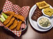 Buffalo Chicken Tenders with Baby Back Ribs and sides of potato salad and mac and cheese at Rib City Grill.