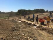 Ridgefield: New Ridgefield High School students spent part of their first day participating in Spudder Day activities, including a service project to help build a 2,000-foot trail at the Ridgefield Outdoor Sports Complex.