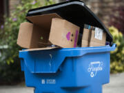 A recycling bin sits outside a Vancouver home. Officials from Clark County, the city of Vancouver and Waste Connections estimate as many as two-thirds of area residents are contaminating their recycling bins with materials that can’t be recycled.