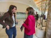 Rep. Jaime Herrera Beutler, R-Battle Ground, left, and Sen. Maria Cantwell, D-Wash., chat Monday morning at the Ed and Dollie Lynch house while celebrating with Columbia Land Trust supporters for their work preserving forests surrounding Mount St. Helens.