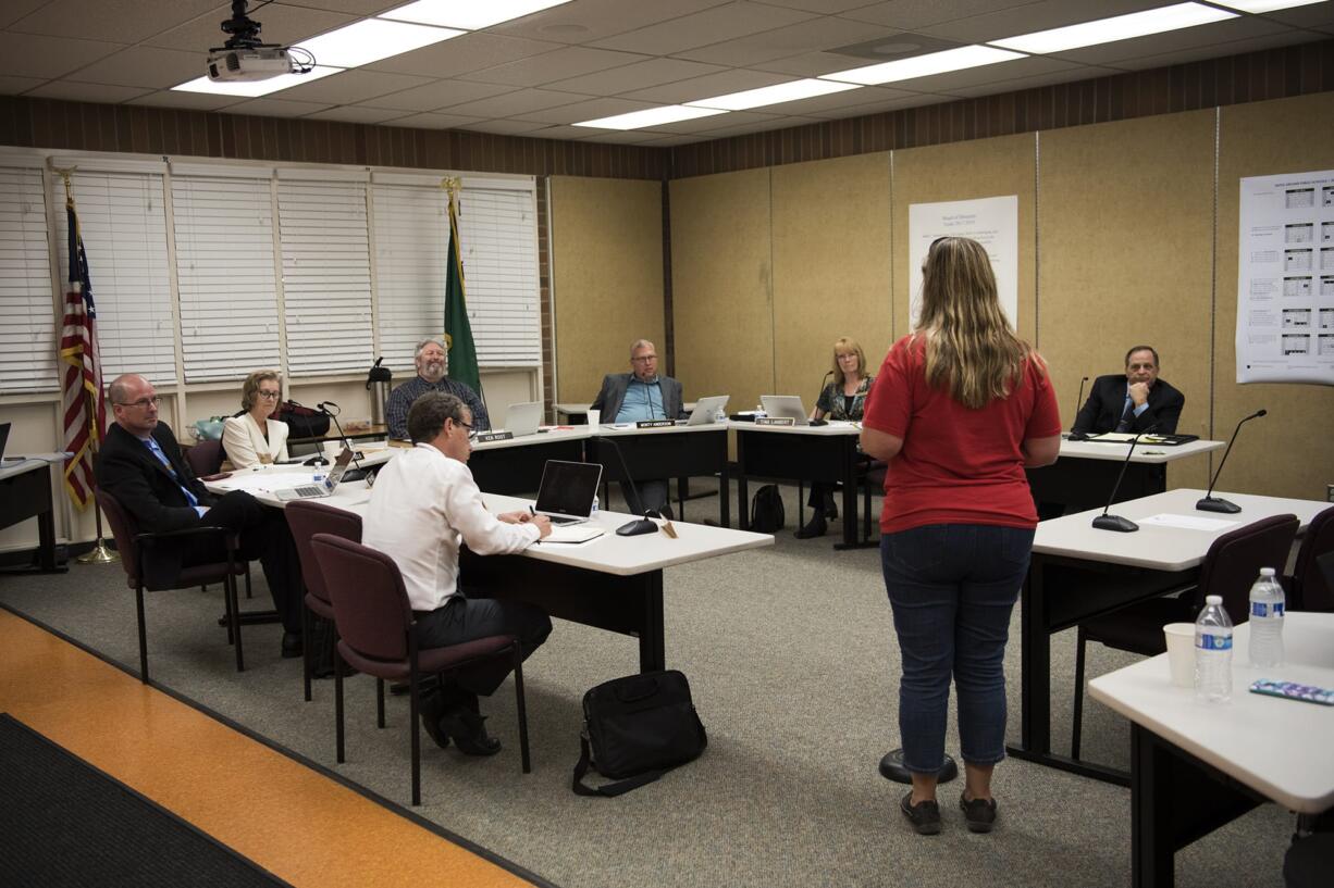 The Battle Ground Public Schools board listens to public comment during a meeting on Sept. 10 at the Lewisville Intermediate Campus in Battle Ground.