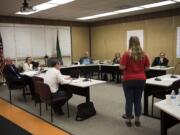 The Battle Ground Public Schools board listens to public comment during a meeting on Sept. 10 at the Lewisville Intermediate Campus in Battle Ground.