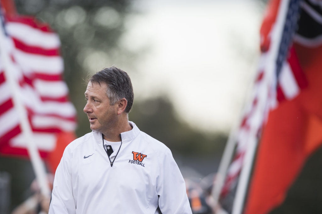 Washougal head coach Dave Hajek walks onto the field before the 2A Greater St. Helens League opener at Washougal High School on Friday, Sept. 14, 2018.