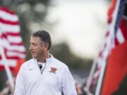 Washougal head coach Dave Hajek walks onto the field before the 2A Greater St. Helens League opener at Washougal High School on Friday, Sept. 14, 2018.