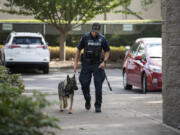 Officer Rocky Epperson and his canine Koa are pictured outside the Vancouver Police Department West Precinct. Koa completed K-9 training earlier this month.