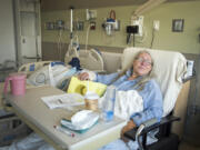 Kathrina Bateman of Skamania waits to be discharged at PeaceHealth Southwest Medical Center in Vancouver on Thursday. Bateman was attacked by five dogs on Tuesday afternoon after visiting a neighbor’s house to inquire about puppies. Her right arm was broken and her left arm and both legs were also wounded in the attack.