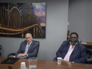 Legislative candidates Paul Harris, left, and Damion Jiles talk with members of The Columbian’s Editorial Board about the 17th Legislative District race Wednesday.