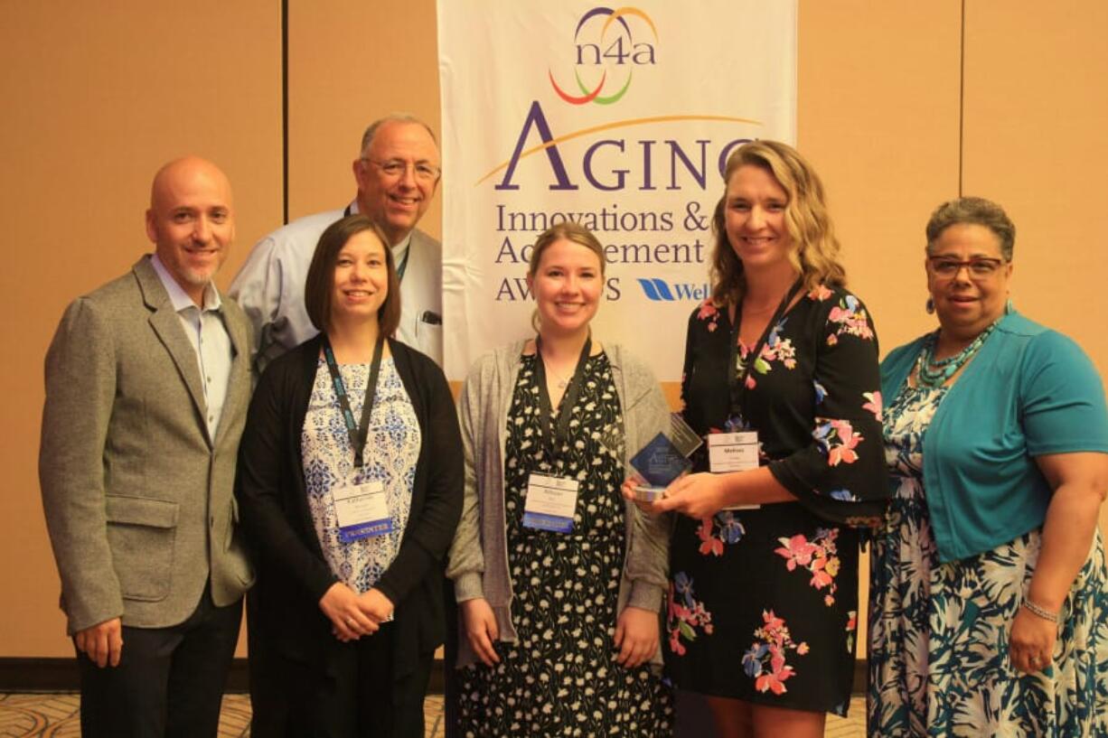 Northeast Hazel Dell: The Area Agency on Aging & Disabilities of Southwest Washington’s Primary Care Liaison program earned an Aging Innovations Award from the National Association of Area Agencies on Aging. From left: Danny Maxson with WellCare Health Plans, Dave Kelly, executive director of the area agency, Katherine Bennett, geriatric medicine training lead with the Northwest Geriatric Workforce Enhancement Center, Allison Boll, primary care liaison with the Aging and Disability Services Seattle King County, Melissa Ensey with aging and disability services, Kathryn Boles, National Association of Area Agencies on Aging president and CEO.